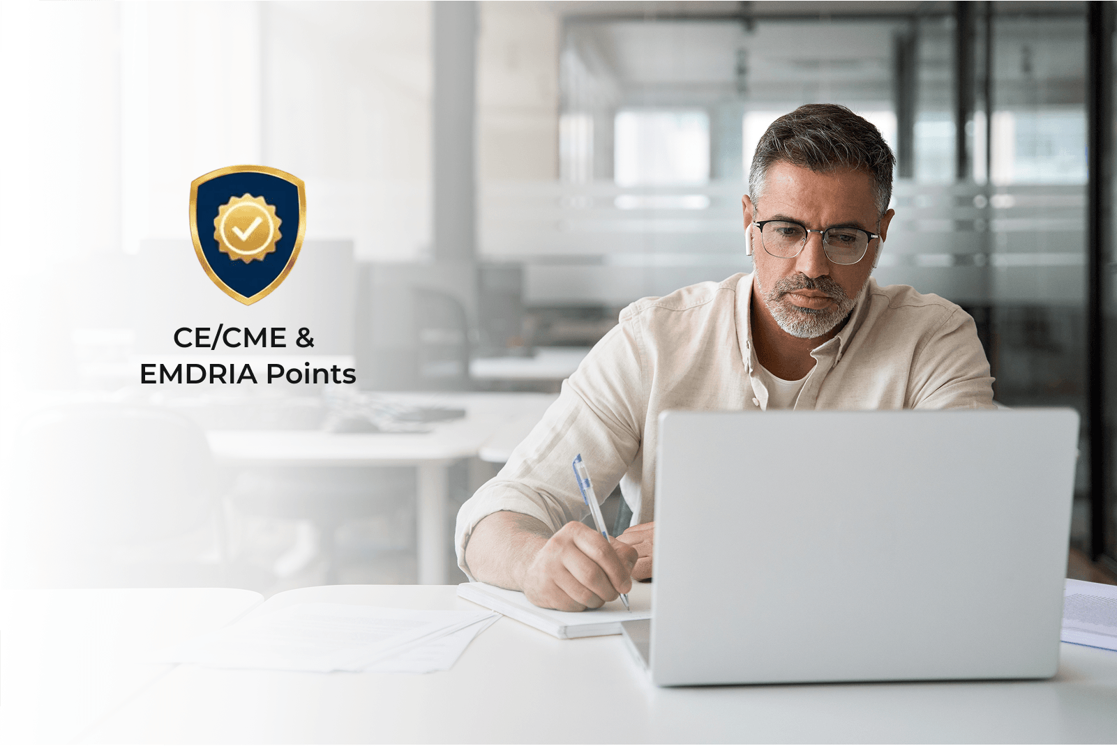 Man at a computer with a CE Badge