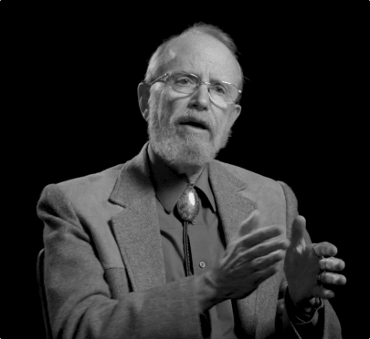 Black and white photo of Bill Miller speaking