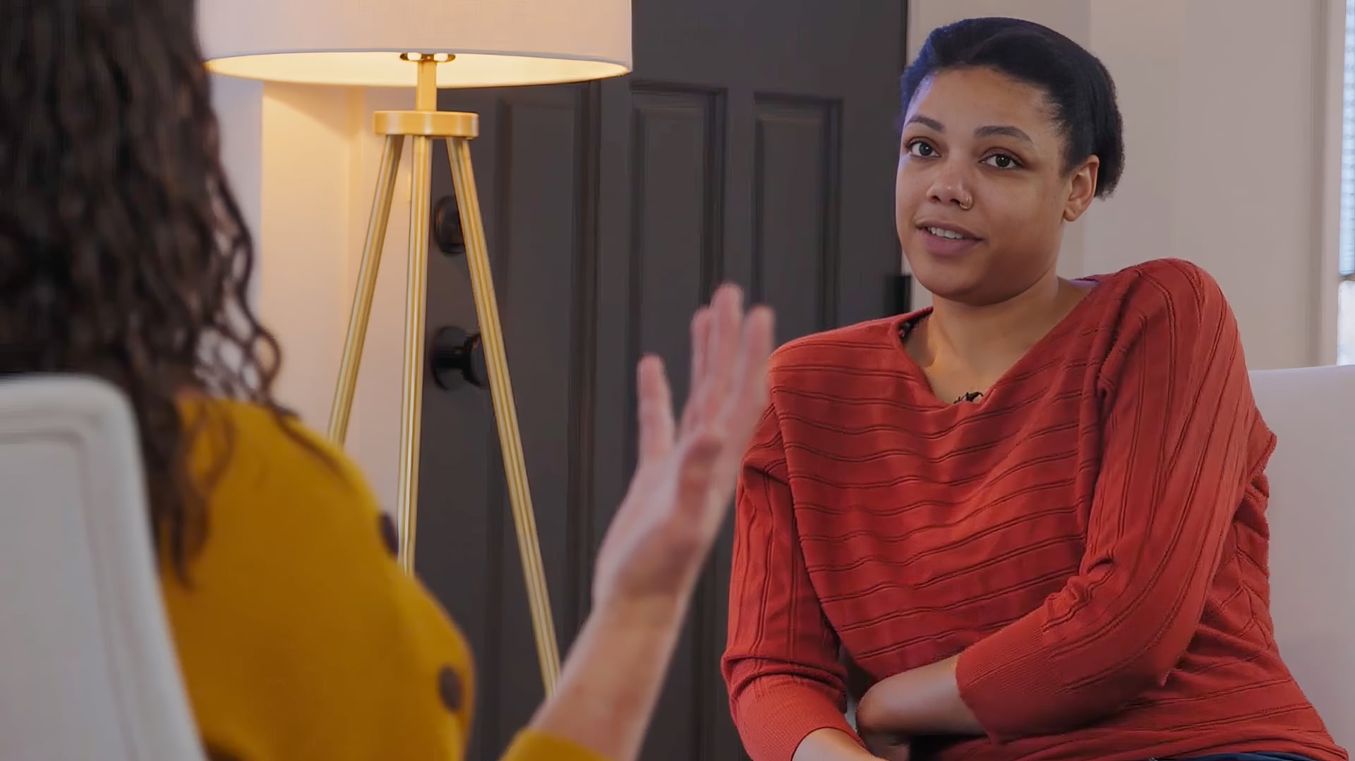 therapy demonstration - client with red jumper looking hesitant