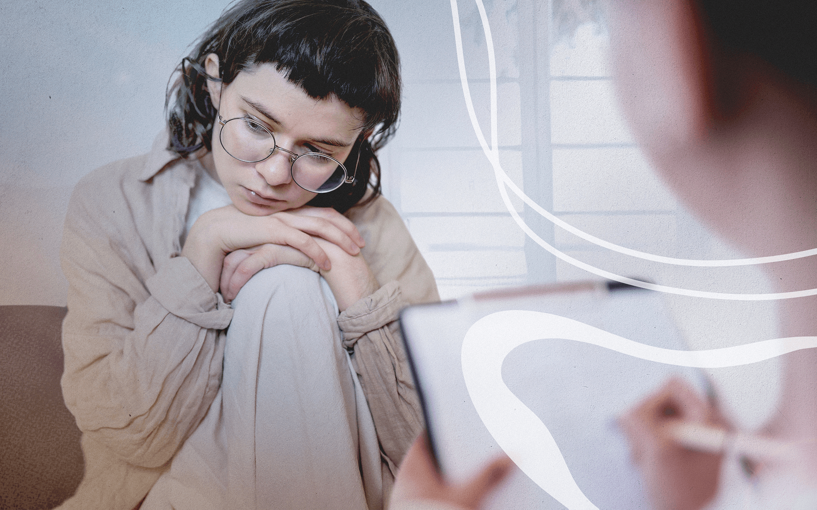 A person with glasses, sitting with their knees drawn up, appears thoughtful or concerned, while another blurred figure in the foreground is writing on a clipboard. The background shows a softly lit, abstract setting with gentle curves and pastel colors.