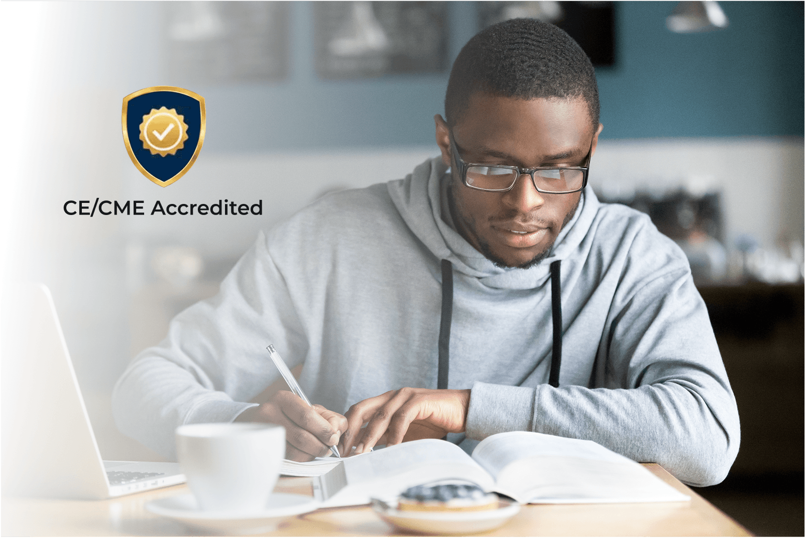 Man at a computer with a CE Badge
