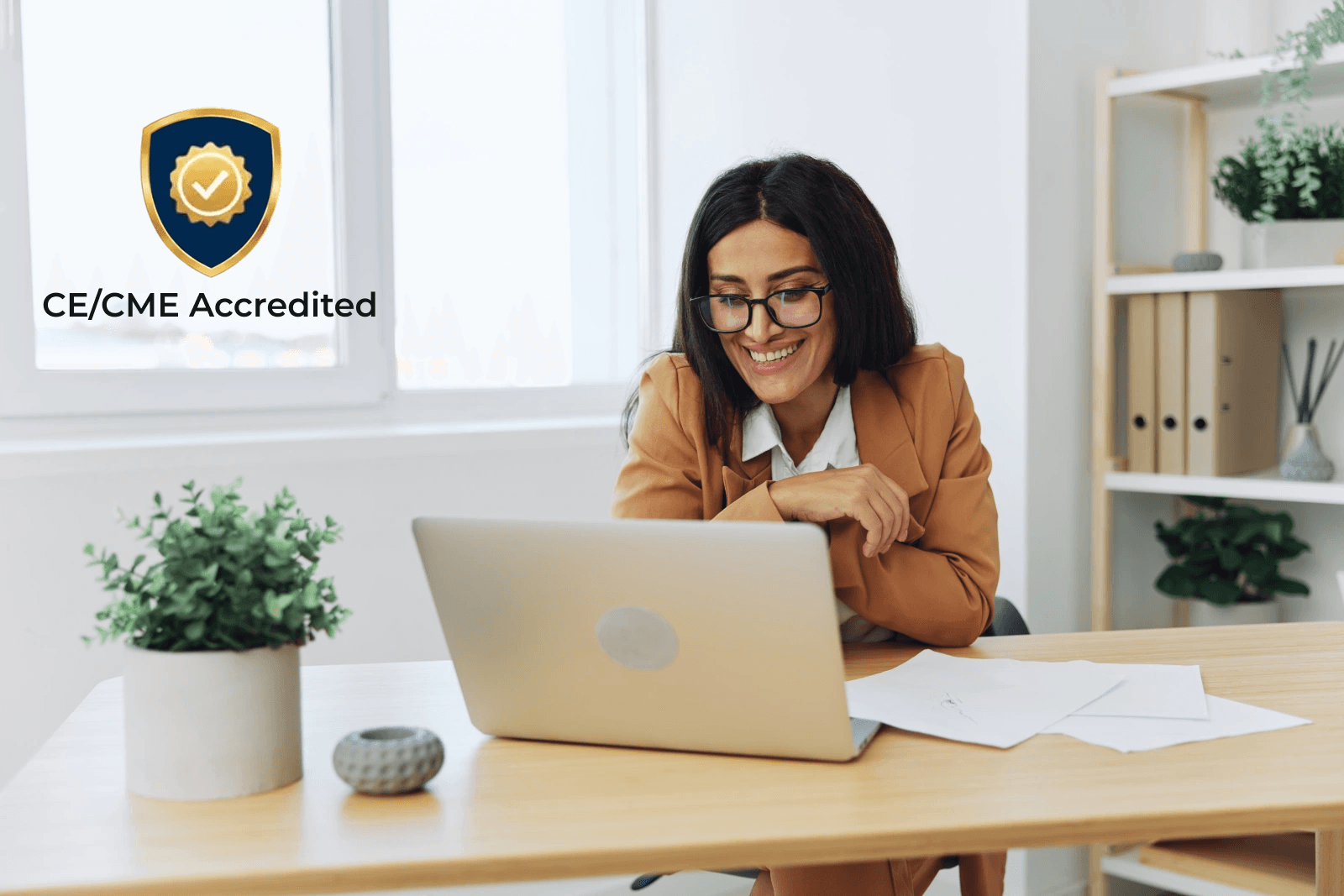 Woman at computer with CE Accreditation badge